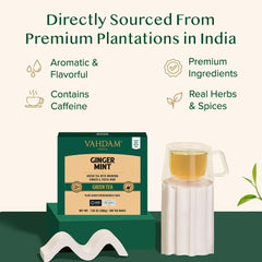 VAHDAM green tea bags pyramid brew close-up revealing full leaf infusion.