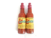 Valentina Mexican hot sauce bottle ready to top tacos and eggs.
