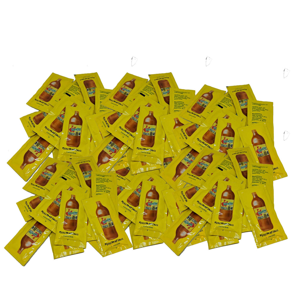 Valentina Mexican Hot Sauce bottle pour adds citrus heat to snacks.