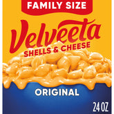 Velveeta Shells & Cheese original box on the kitchen counter, ready to prepare.