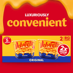 Two-pack of Velveeta shells with pasta close-up showing creamy coating.