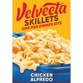 Velveeta Skillets Chicken Alfredo box packaging highlights quick, creamy dinner option.