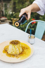Villa Jerada Dukkah over dips and veggies for a flavorful bite.