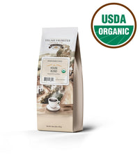 Village Favorites Arabica beans close-up highlighting chocolatey notes and balanced body.