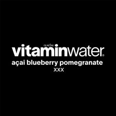Vitaminwater XXX Acai Blueberry Pomegranate 12-pack display on a store shelf for convenient hydration.