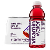 Vitaminwater XXX Acai-Blueberry-Pomegranate bottle pour showcasing zero sugar hydration on the go
