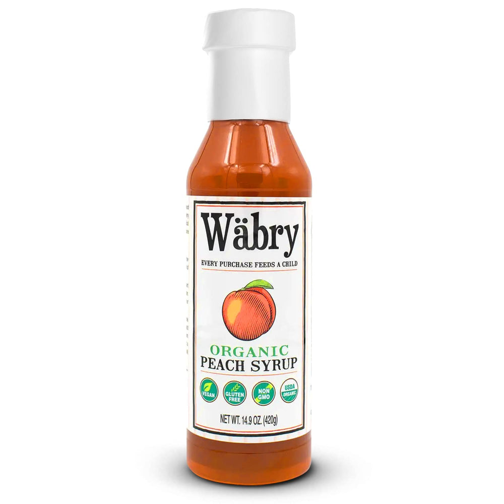 Wäbry Organic Peach Syrup bottle, natural flavor with peach notes for drinks and desserts.