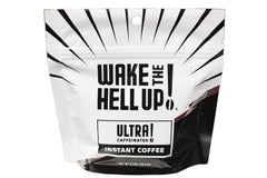 Wake The Hell Up! travel-size coffee container ideal for on-the-go energy.