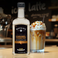 Creamy latte with caramel drizzle showing Watkins flavor for at-home baristas.
