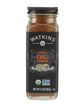 Watkins chili powder in a square glass bottle for organized pantry storage.