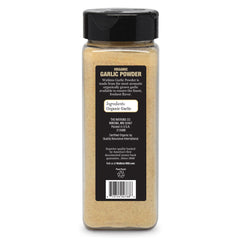Watkins garlic powder spoon dipping into sauce for depth.