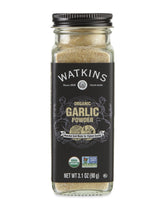 Watkins Garlic Powder bottle on a shelf, quick flavor access for meals.