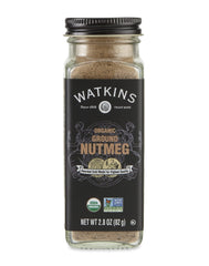 Watkins ground nutmeg in a square glass grinder, ideal for desserts and warm beverages.