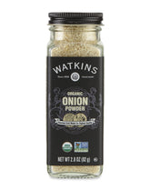 Watkins Onion Powder in a square glass grinder for easy, mess-free seasoning.