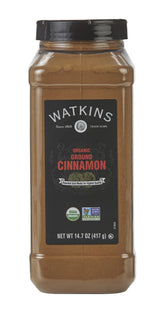 Watkins Organic Ground Cinnamon on spoon, warm aroma for baking
