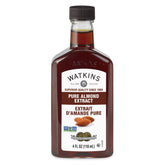 Watkins Pure Almond Extract bottle in a kitchen, ideal for baking and flavoring drinks.