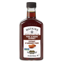 Watkins Pure Almond Extract bottle in a kitchen, ideal for baking and flavoring drinks.