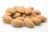 We Got Nuts jumbo California almonds in-shell close-up, fresh and unsalted for on-the-go snacking.