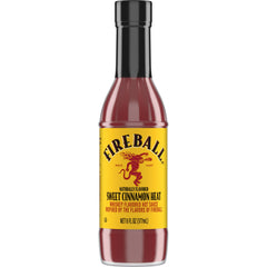 Weber Fireball hot sauce bottle on grill, ideal for bold wings and ribs.