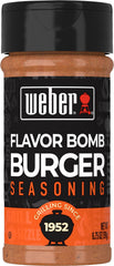Weber Flavor Bomb Burger Seasoning bottle on counter for rich grilling flavor.