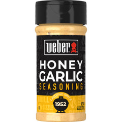 Weber Honey Garlic Rub bottle-front showing glossy seasoning ready for pork or chicken