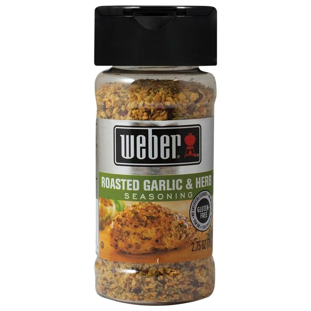 Weber Roasted Garlic & Herb Seasoning shaker on counter boosts grilling flavor.