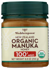 Wedderspoon Manuka Honey 100+ MGO jar with creamy texture, perfect for tea and toast.
