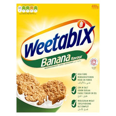 Weetabix Banana Biscuits milk dunk closeup emphasizes texture