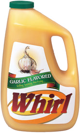 Whirl Garlic Butter Oil bottle pour enhances flavor for sautéed dishes.