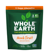 Whole Earth Monk Fruit Sweetener with Erythritol jar on kitchen counter for baking and cooking.