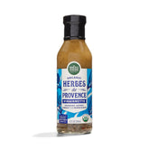 Whole Foods Market Organic Herbes de Provence Vinaigrette bottle pouring over greens for fresh flavor