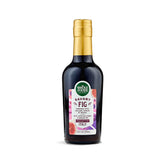 Whole Foods Market savory fig condiment bottle label highlights premium balsamic base for versatile finishing.