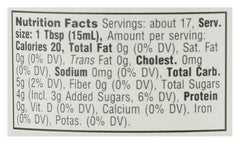 Whole Foods Market fig condiment on pantry display, ready to drizzle over veggies.