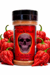 Wicked Tickle Black Skull smoked ghost pepper powder bottle showing bold heat and smoky aroma.