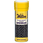 Wilton black decorating sugar pearls in a bottle add elegant cake contrast.