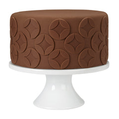 Wilton Decorator Preferred Chocolate Fondant leaves and ribbons shaping for elegant accents.