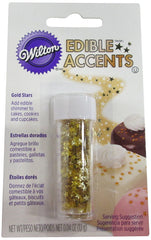 Wilton edible gold star sprinkles topping a birthday cake for a refined finish.