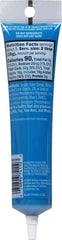 Wilton gel icing sparkle blue used to write letters on a cake