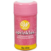 Wilton Pink Spring Sugar bottle pour for precise cake decorating and flow control.