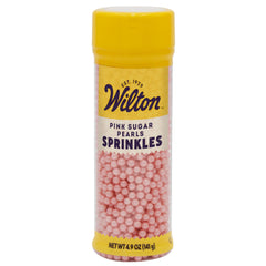 Wilton Pink Sugar Pearls elevate cakes with elegant pink sparkle.