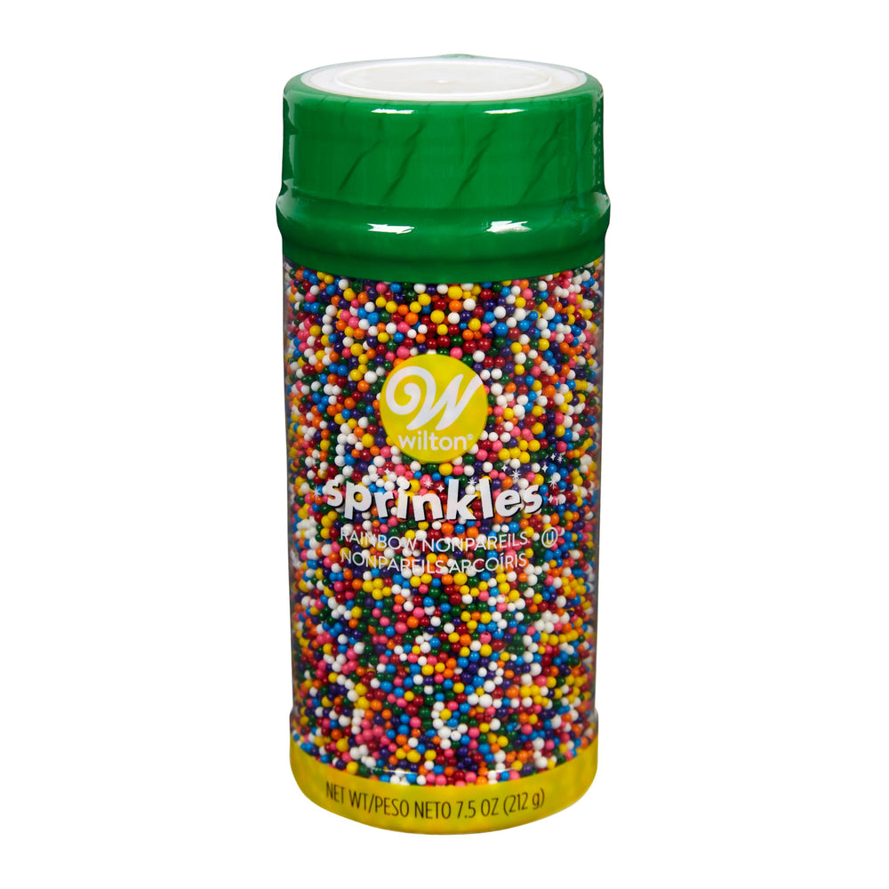 Wilton Rainbow Nonpareils bottle front with colorful daisy shapes for vibrant cupcakes