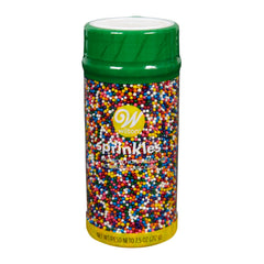Wilton Rainbow Nonpareils bottle front with colorful daisy shapes for vibrant cupcakes