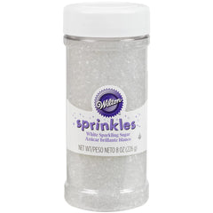 Wilton Sugar Sprinkles White 8oz add subtle shine to cupcakes, cookies, and celebrations.