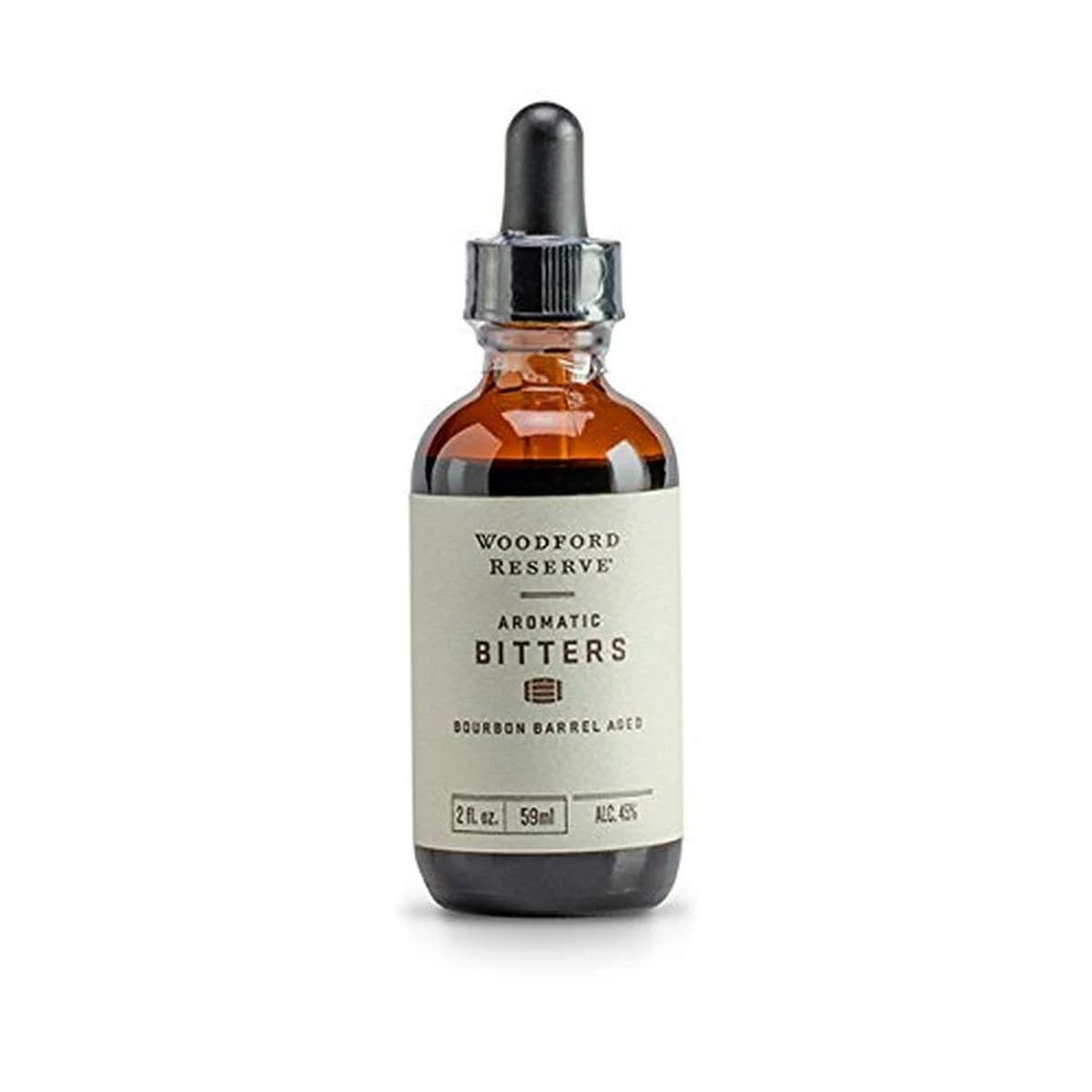 Woodford Reserve Aromatic Bitters bottle pour, enhancing cocktails with a refined aromatic blend