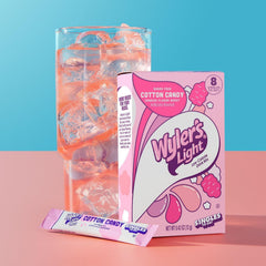 Wyler's Light Watertok Cotton Candy packet stirred into water for a refreshing treat.