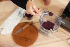 Powder sprinkled into a smoothie for berry-rich flavor and color.