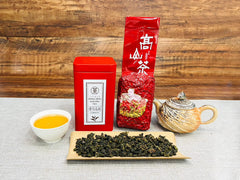 XINQING High Mountain Oolong tea in a cup showing a golden infusion.