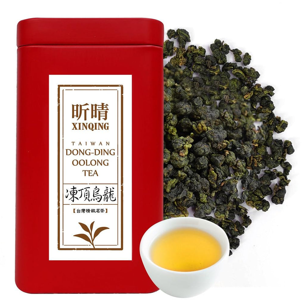 XINQING Taiwan High Mountain Oolong tea leaves in a scoop, fragrant aroma ready to brew.