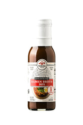 Yamasa Shoyu broth concentrate bottle highlighting rich umami for ramen and sauces.