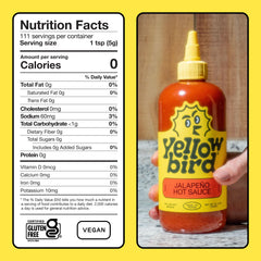 Yellowbird Classic Jalapeño hot sauce label close-up highlights vegan and gluten-free ingredients.